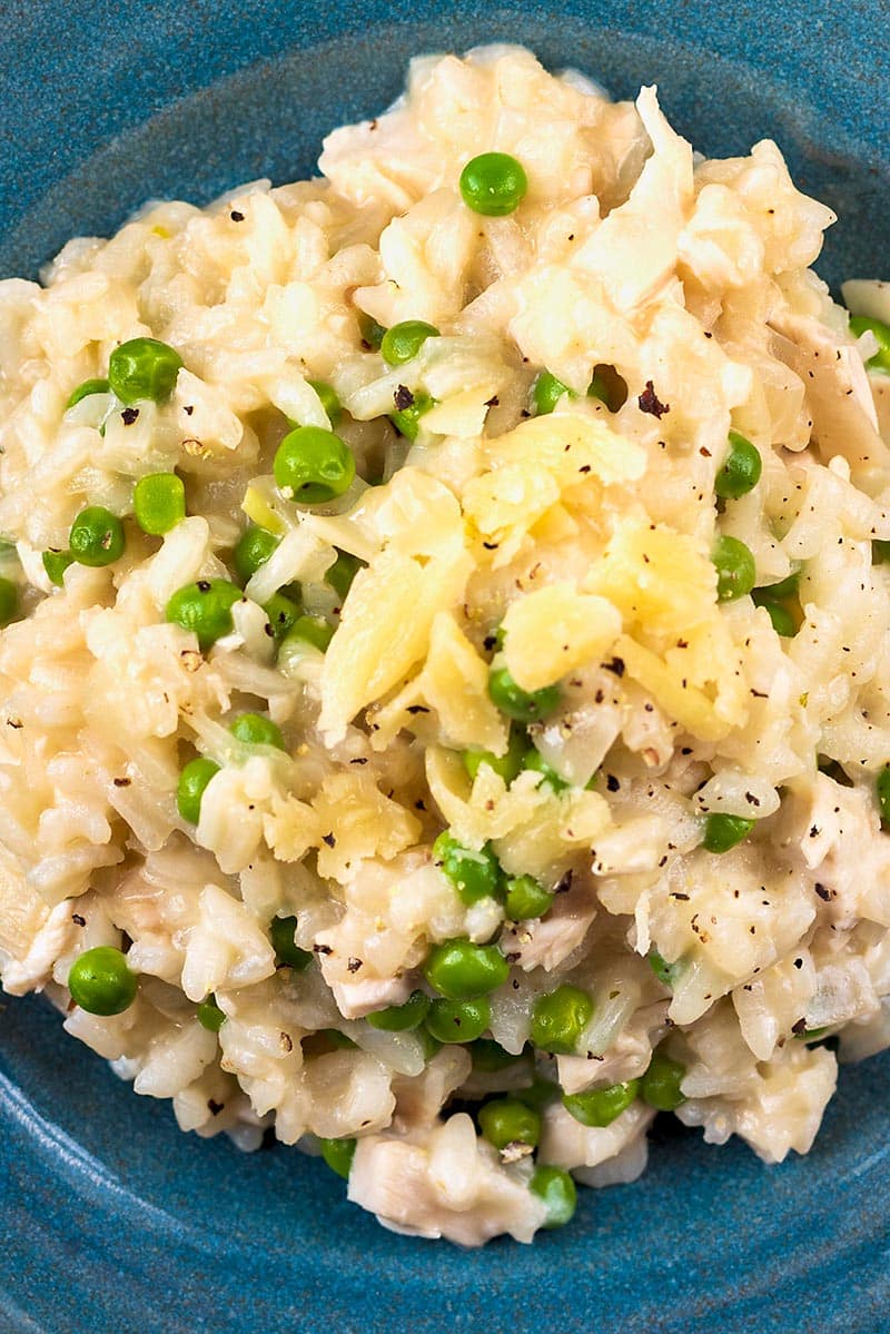 Pea and chicken risotto topped with Parmesan shavings.