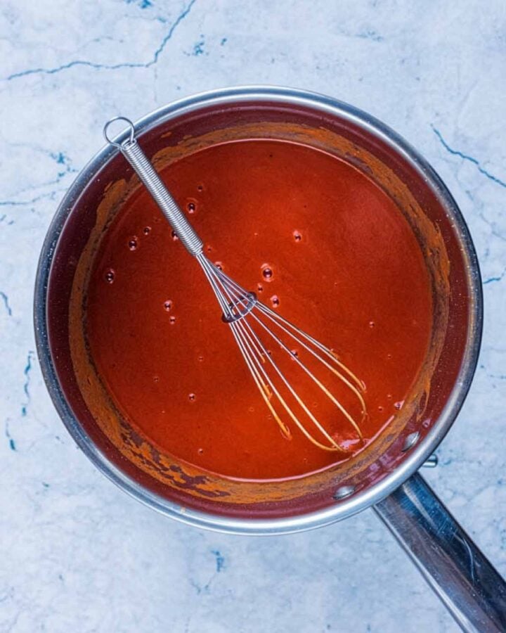 Enchilada sauce in a saucepan.