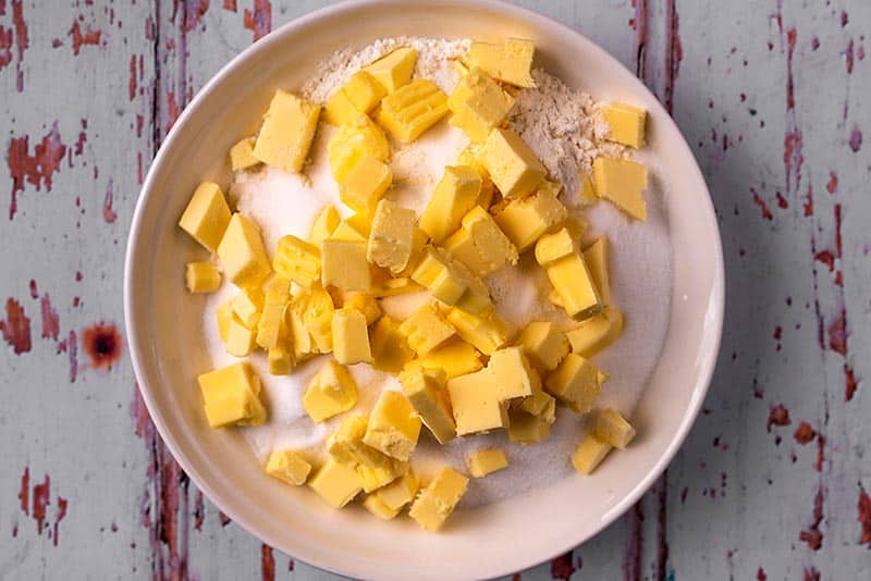 Flour and cubes of butter in a bowl.