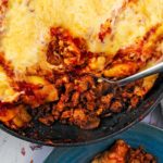 Skillet Lasagna with a spoon scooping the filling.