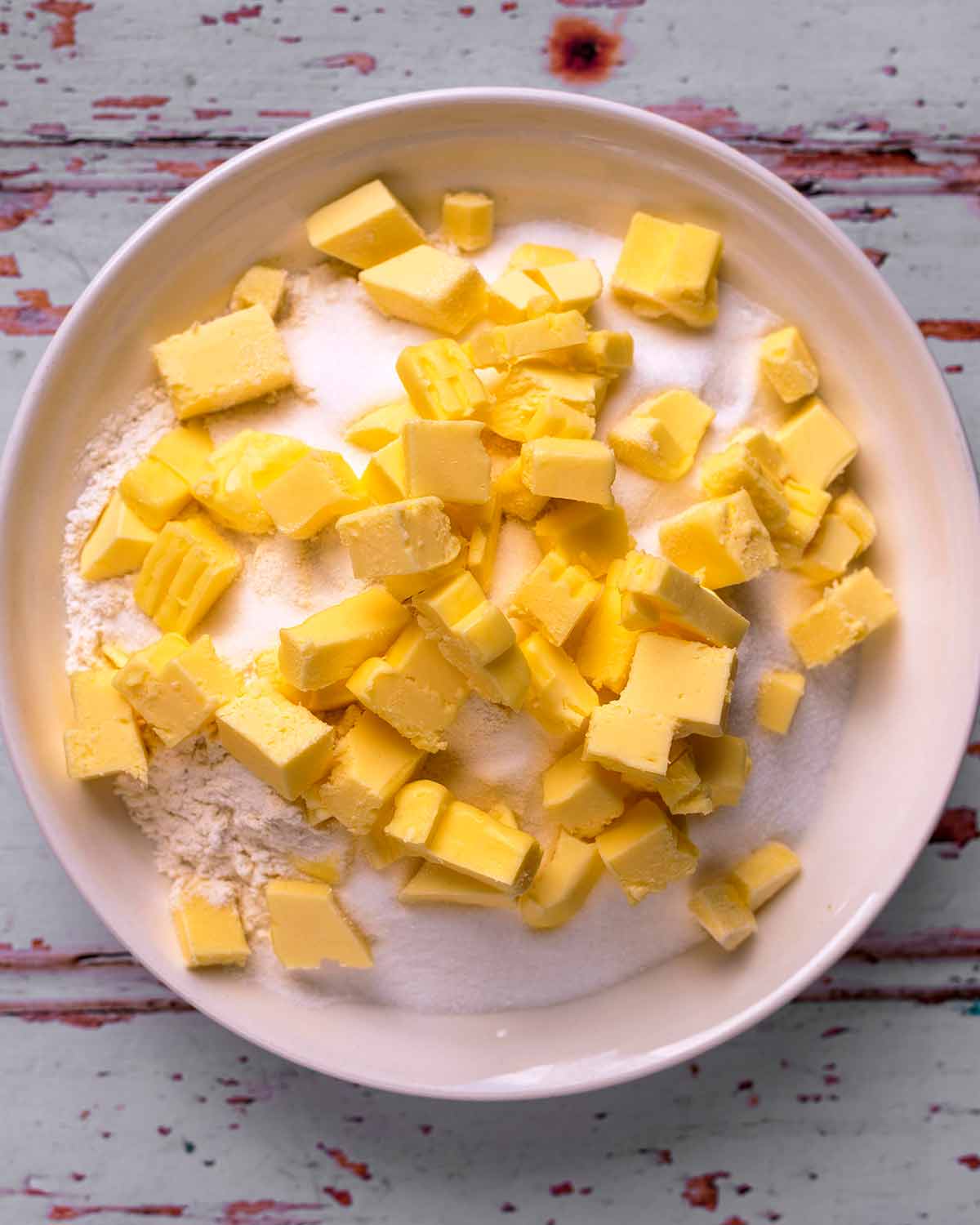 Flour and cubes of butter in a bowl.