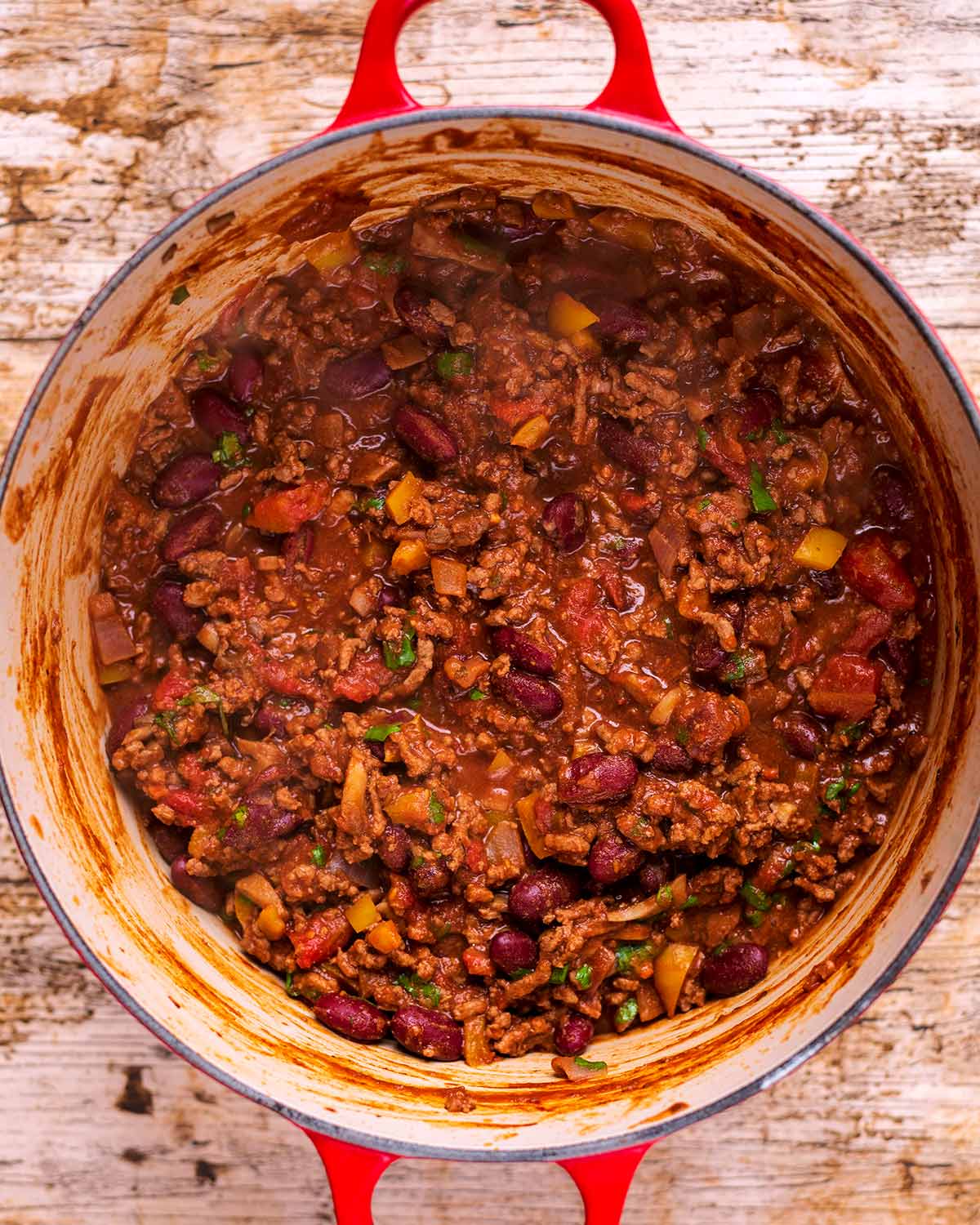 A large red pot full of chilli con carne.