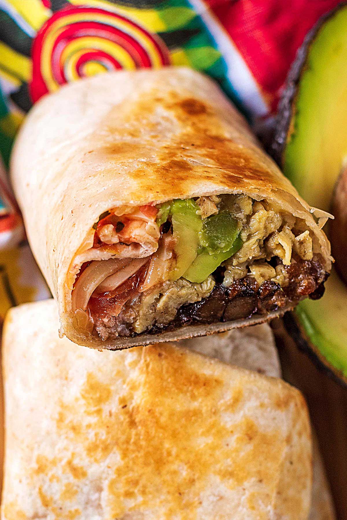 A cut burrito showing all the filling.