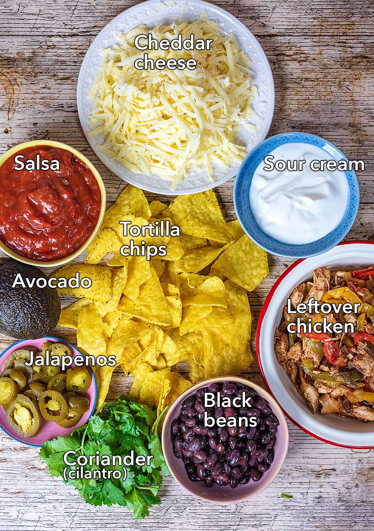 All the ingredients needed to make this recipe all laid out on a wooden surface.