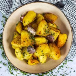 Easy roast potatoes in a large round serving bowl.