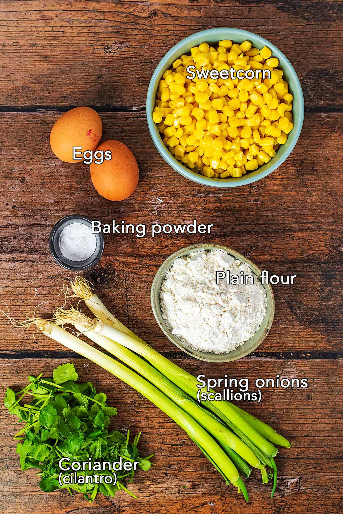 All the ingredients needed to make this recipe laid out on a wooden surface.