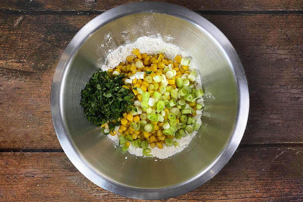 Sweetcorn, spring onion and coriander added to the bowl.