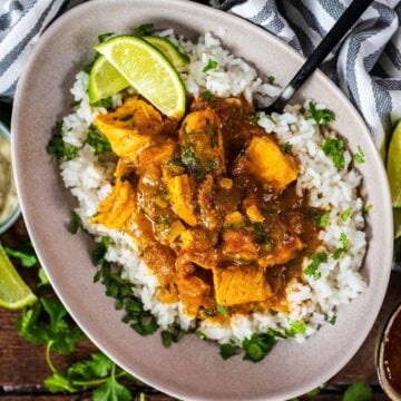 Salmon curry and rice in a large bowl.