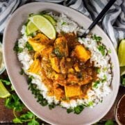 Salmon curry with a text overlay title.