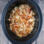 Slow cooker chicken fajitas in a slow cooker bowl.