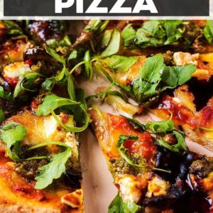 Eggplant pizza with a slice cut out and a title text overlay.