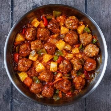 A pan full of sweet and sour chicken meatballs.