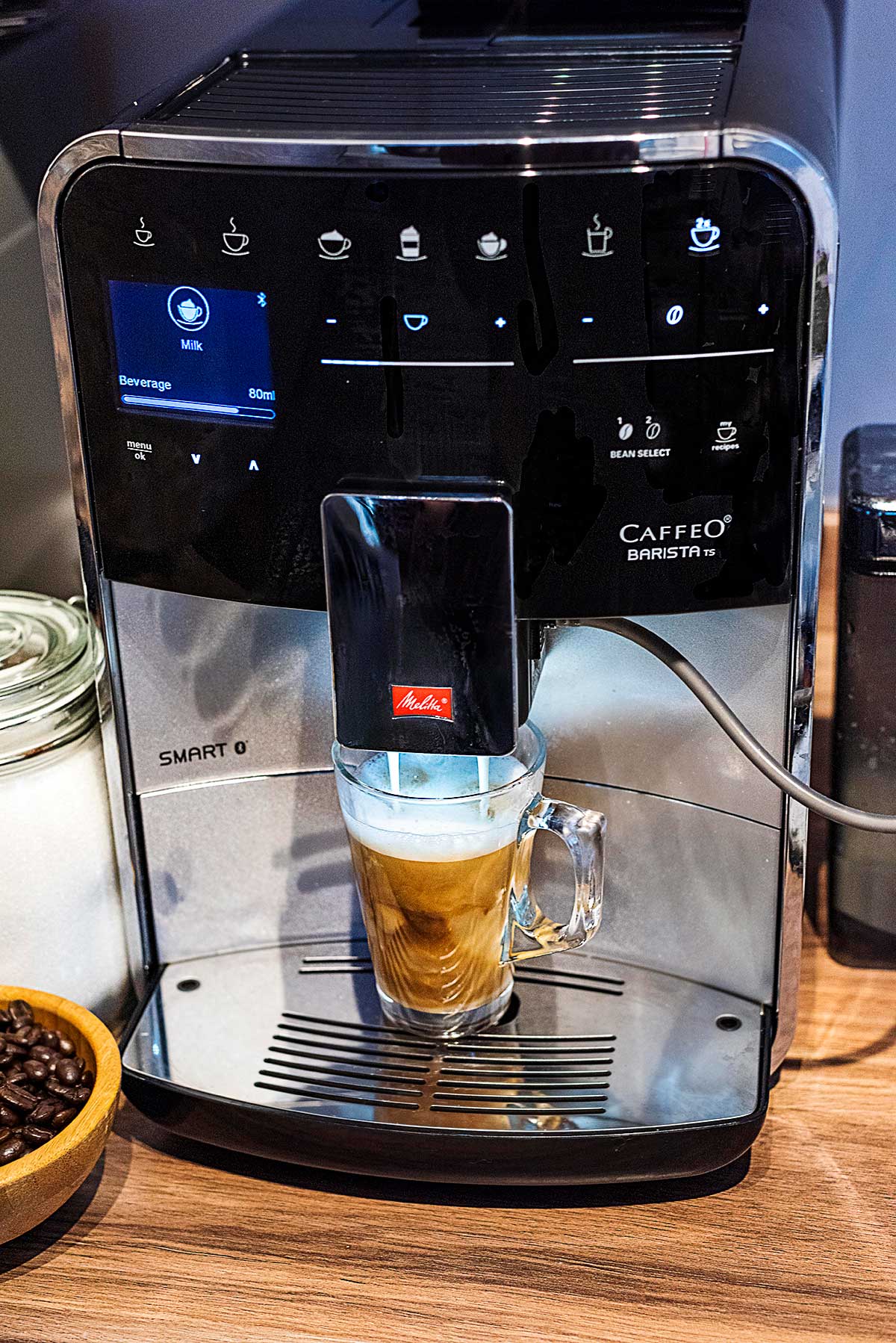 A Melitta coffee machine brewing a drink into a glass.