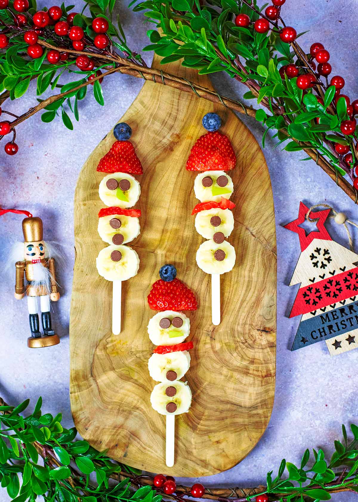 Slices of banana arranged into a snowman shape.
