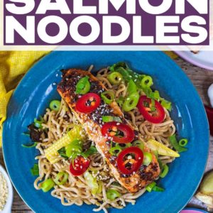 Soy ginger salmon noodles on a blue plate with a text title overlay.