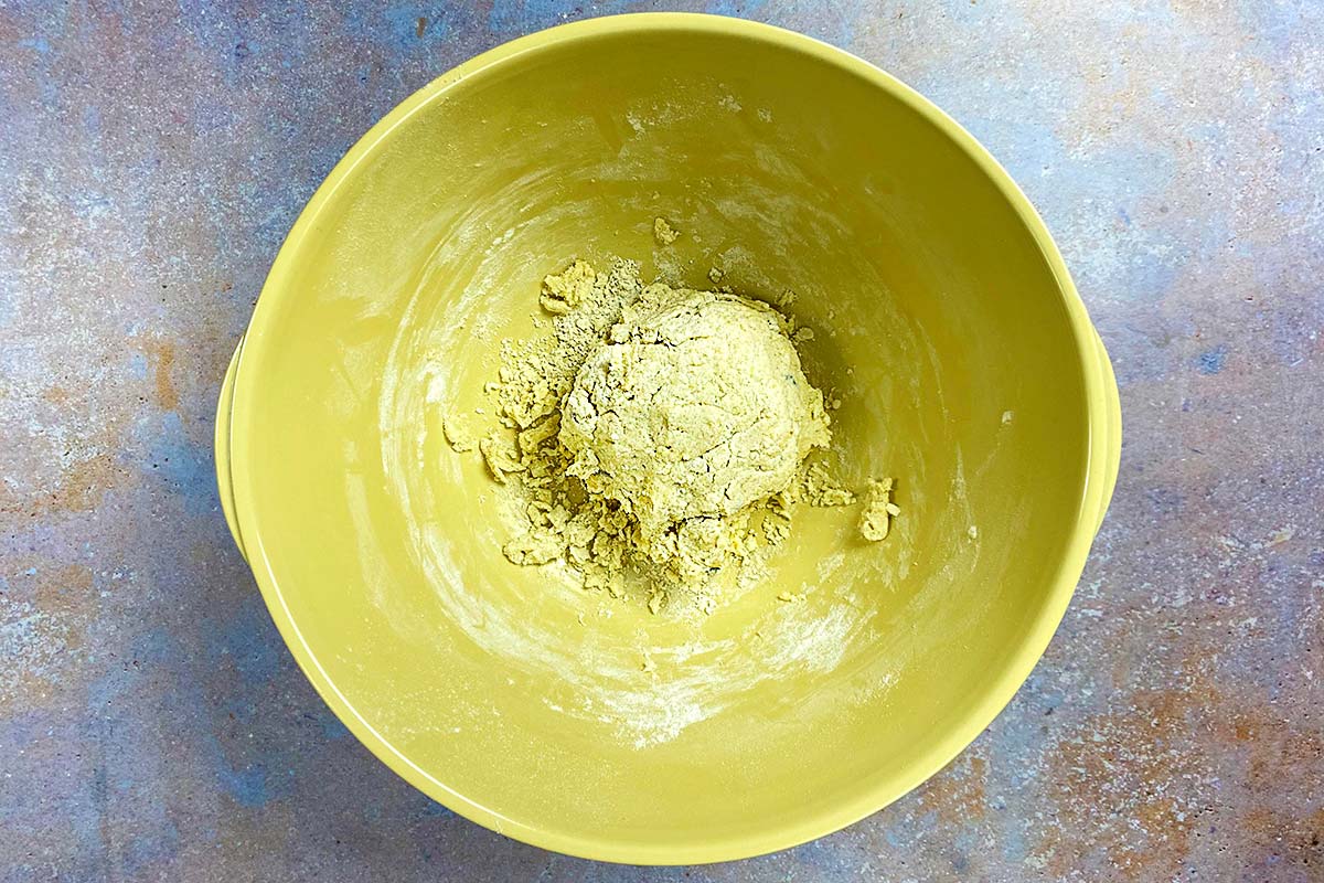A large mixing bowl containing gnocchi dough.