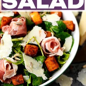 A bowl of prosciutto salad with a text title overlay.