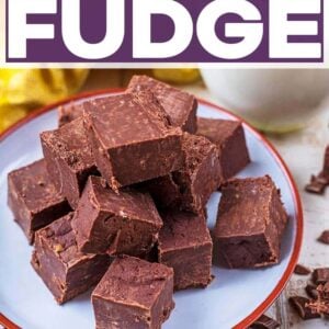 Cubes of chocolate fudge on a plate with a text title overlay.