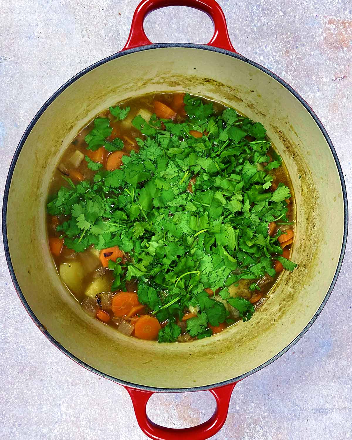 Chopped coriander added to the pan.