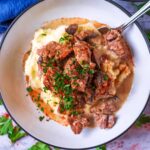 A bowl of slow cooker beef stroganoff with mashed potato