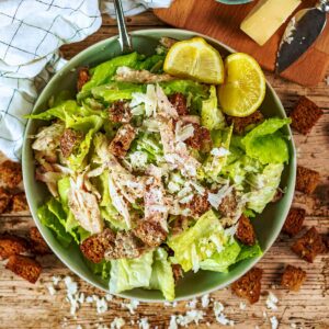 Healthy Caesar salad in a large bowl.