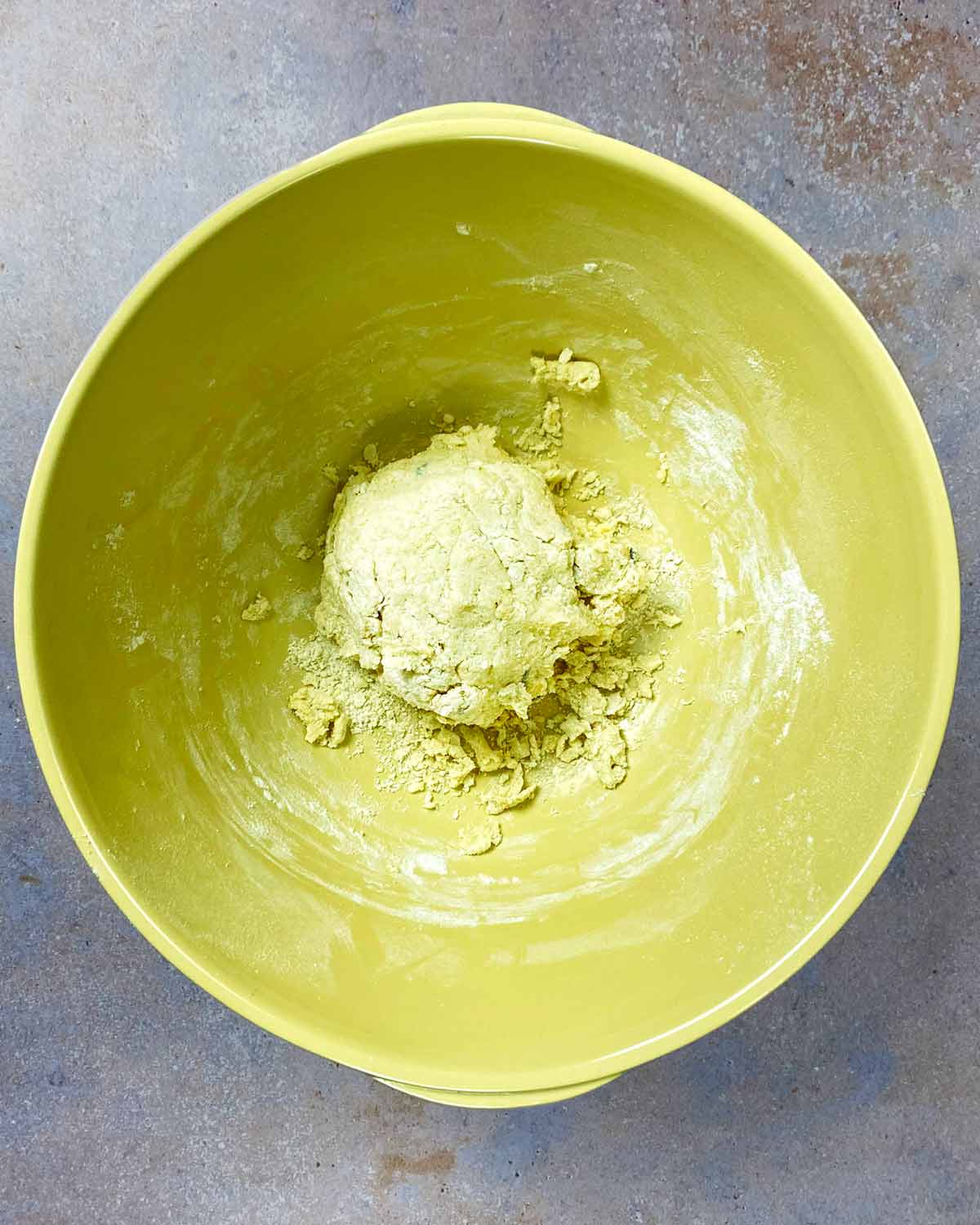 A large mixing bowl containing gnocchi dough.