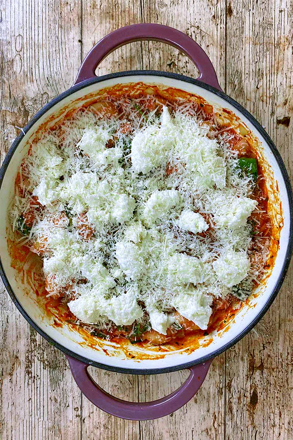 Gnocchi bake covered in grated Parmesan and chunks of mozzarella.