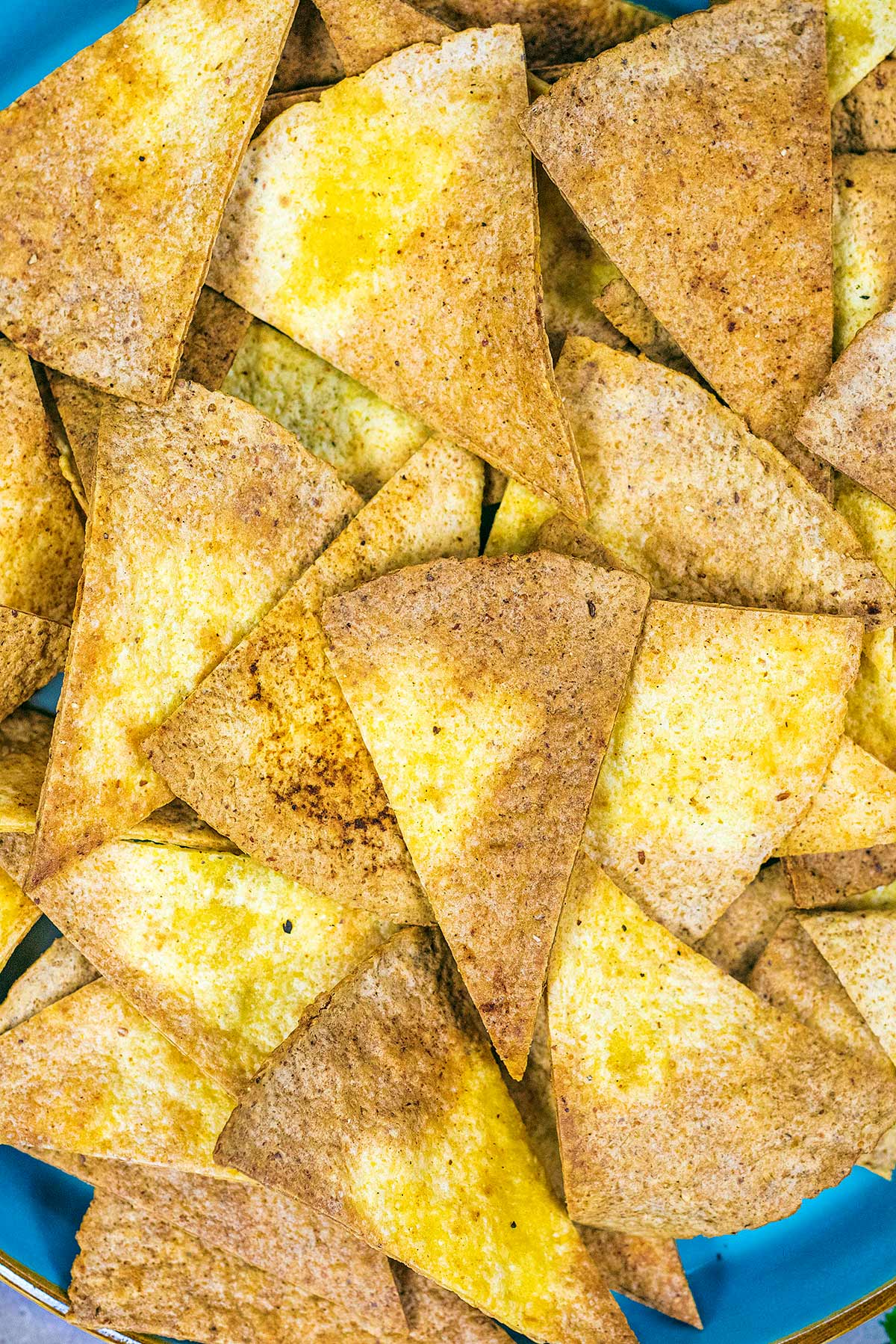 Tortilla chips laid out over a plate.
