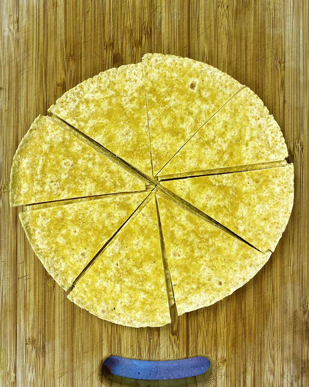 Corn tortillas cut into triangles and brushed with oil.