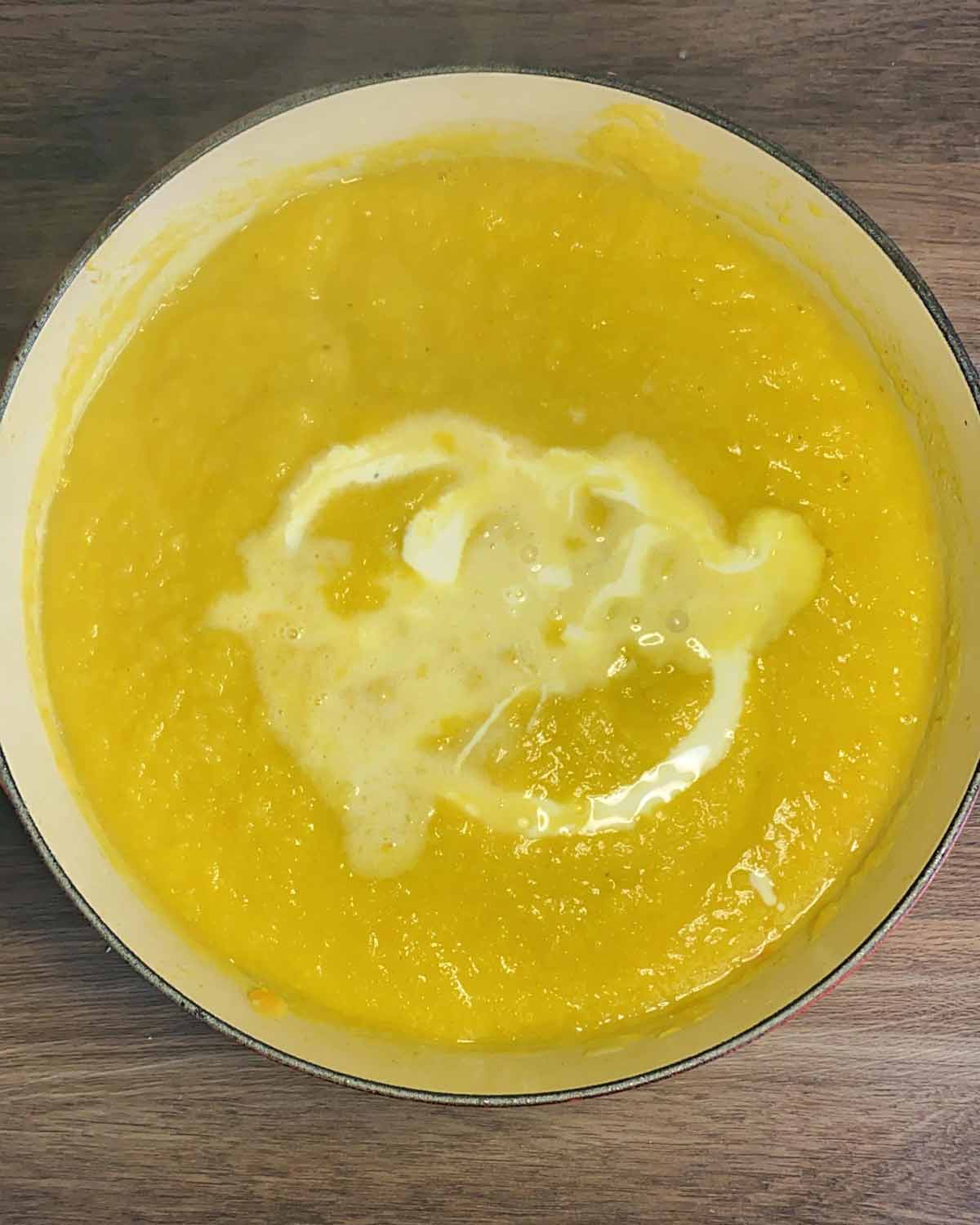 Milk and cream swirled into the blended soup.