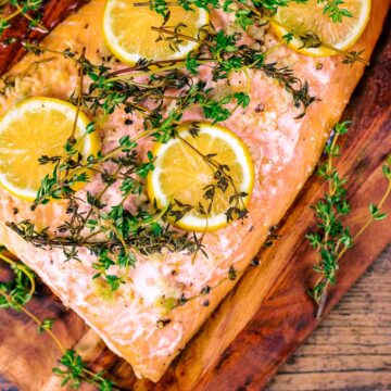 Baked salmon on a wooden board.