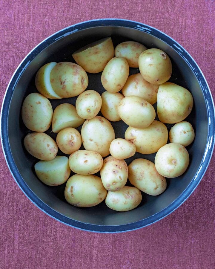 A saucepan full of baby potatoes.