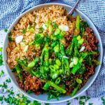 Sticky Ginger Beef in a bowl with rice and broccoli.