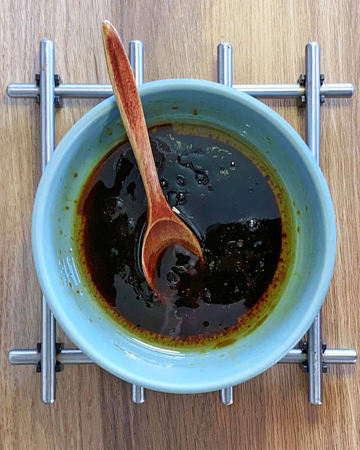 A bowl of soy sauce based marinade.
