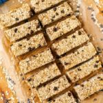 Fourteen healthy flapjacks on a sheet of parchment paper.