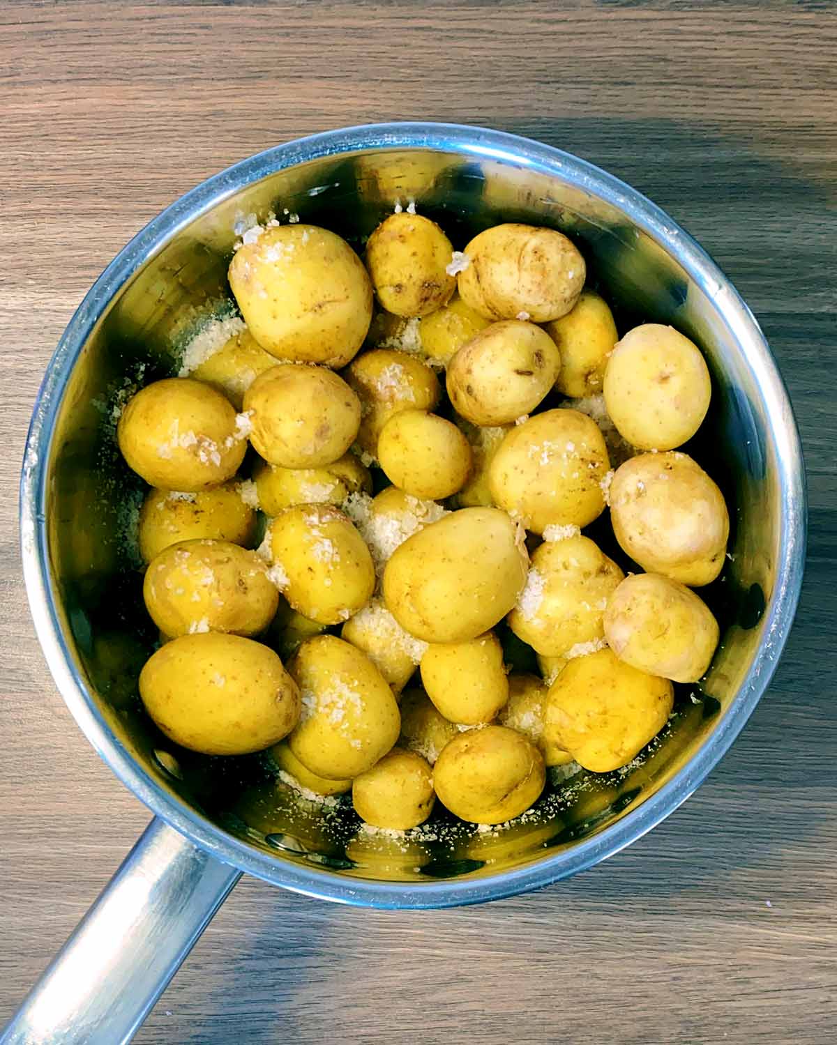 A pan of small potatoes and salt.