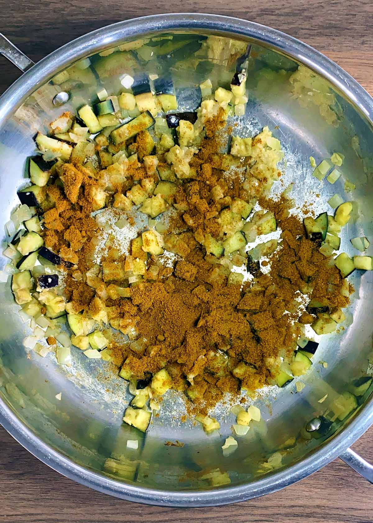 Curry powder added to the pan.