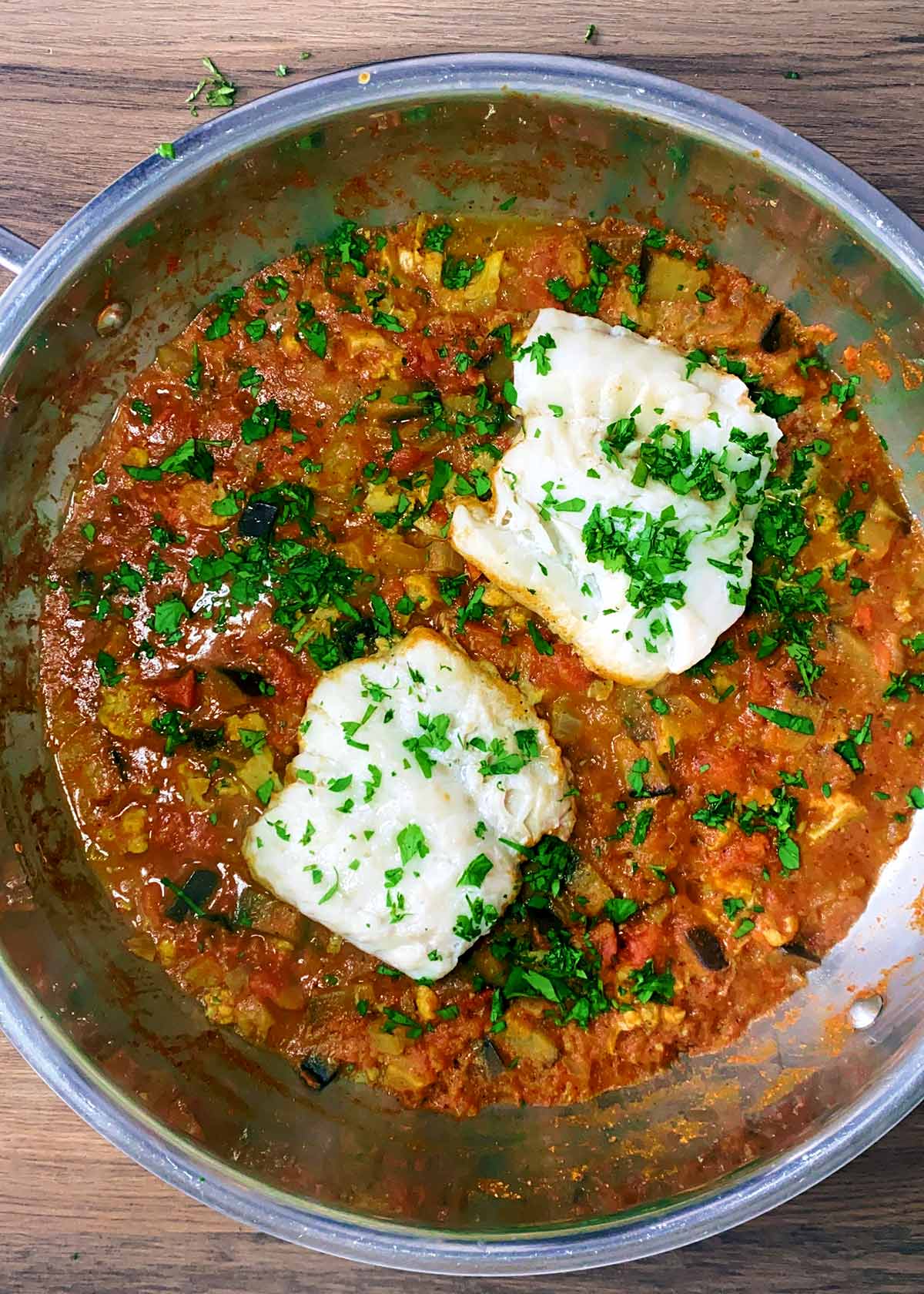 The cod now cooked and chopped coriander sprinkled over the curry.