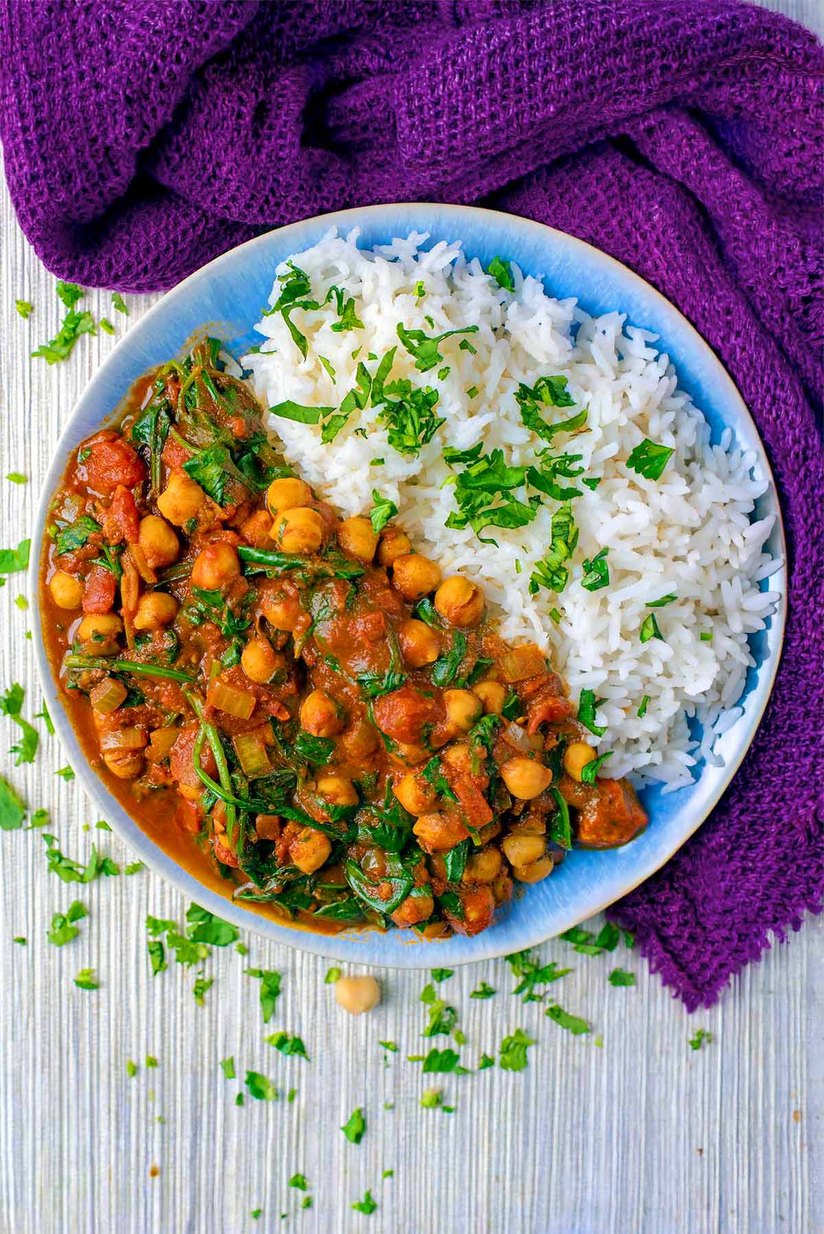 Curried chickpeas and rice on a blue plate.