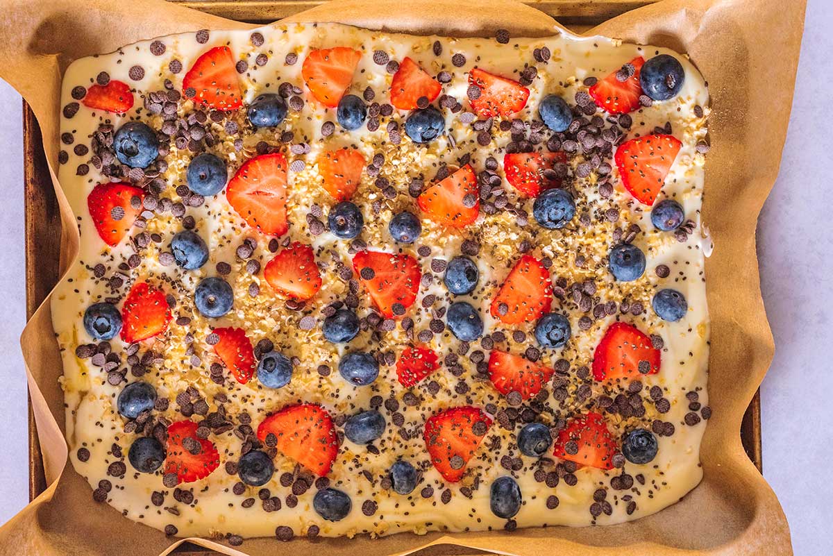 Berries and chocolate chips added on top.