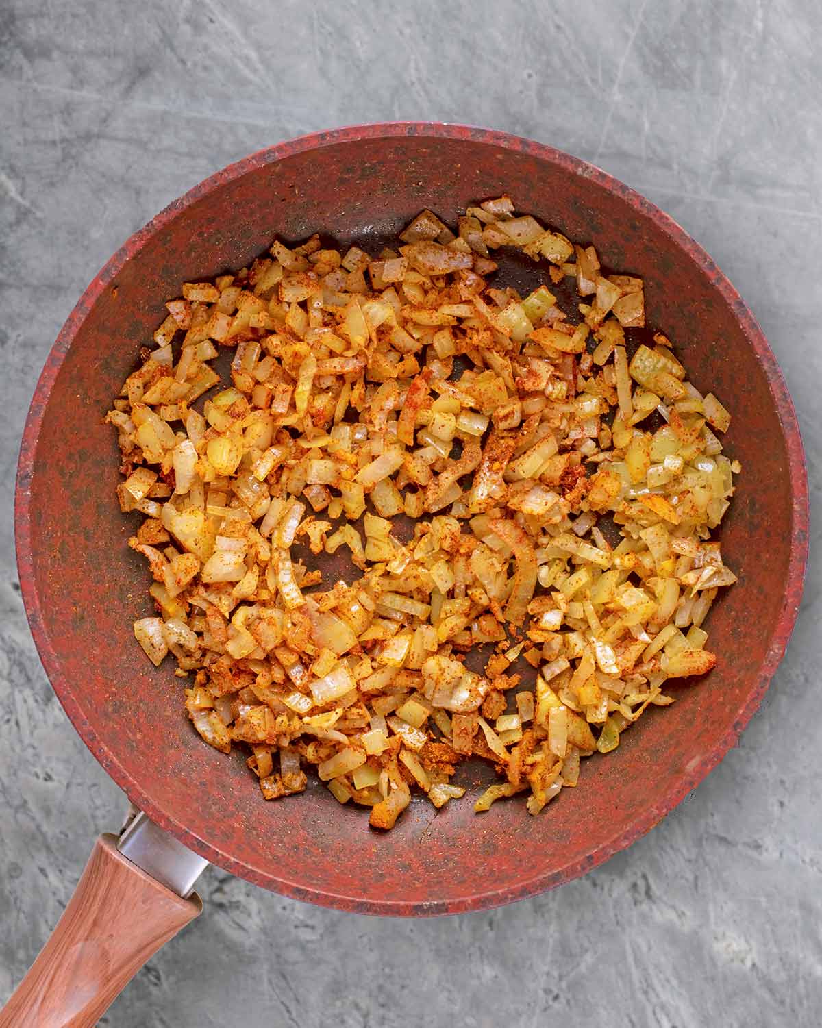 Spices added to the onions and mixed in.