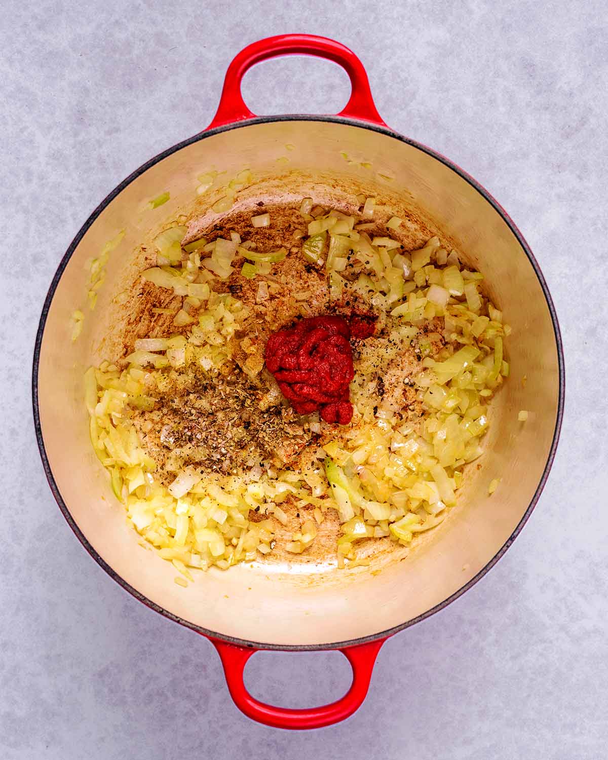 Tomato puree, chipotle paste and spices added to the pan.