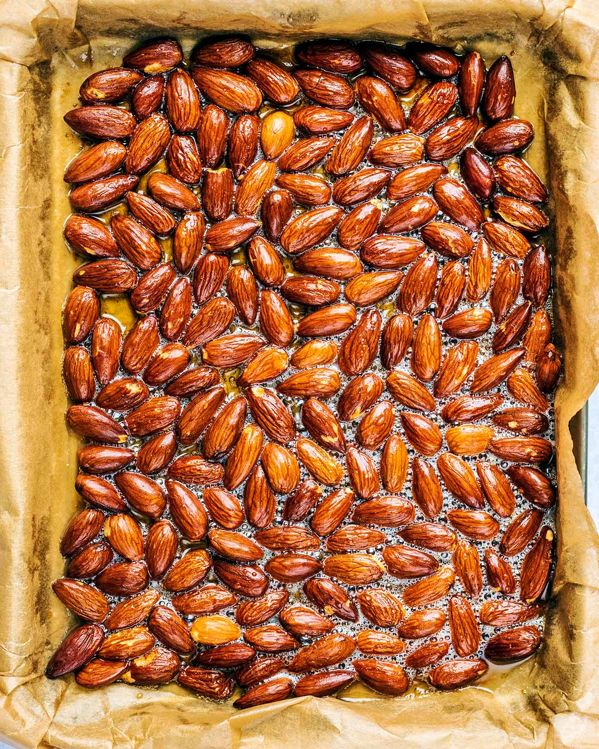 Roasted almonds on the baking tray.