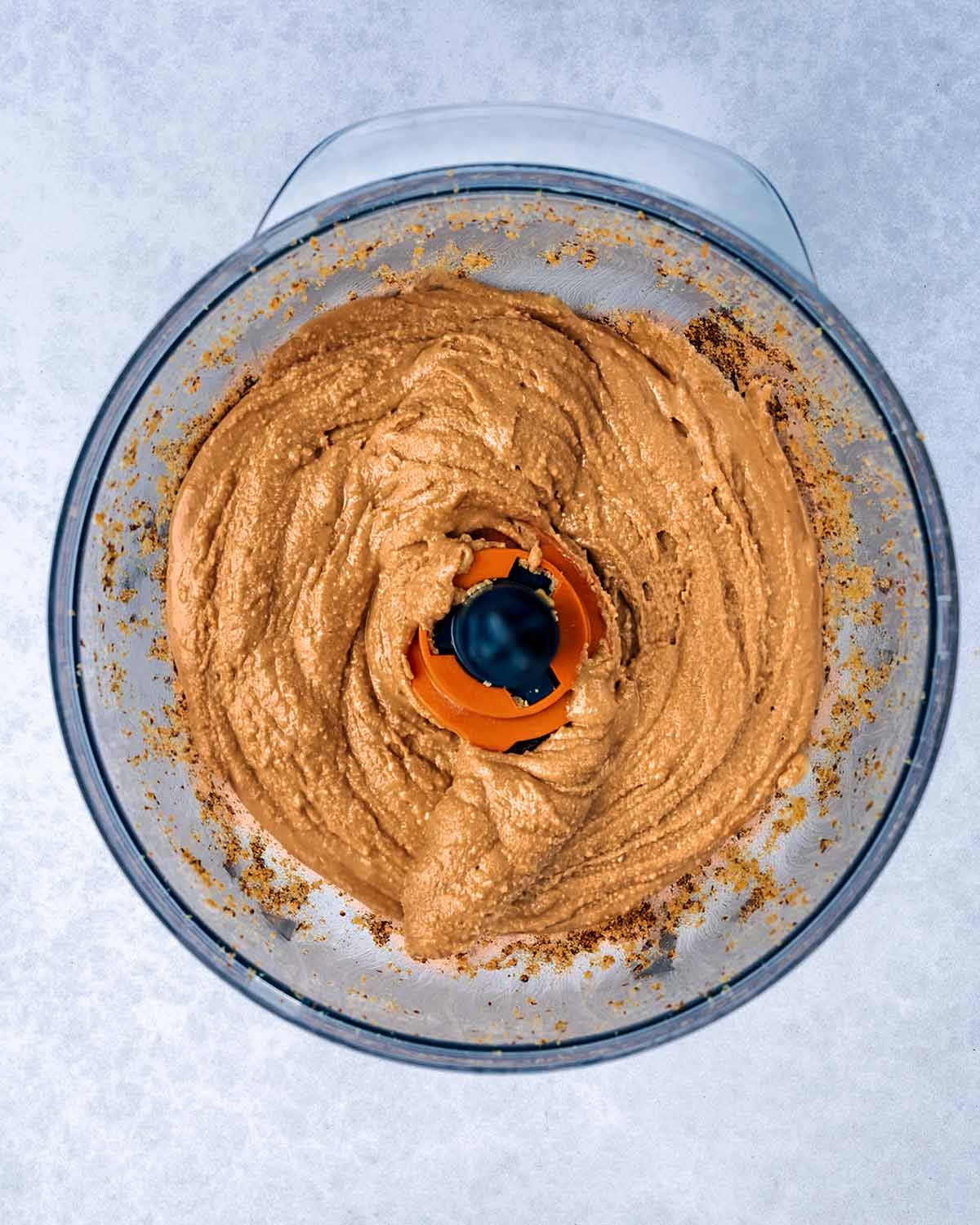 Processed almond butter in the food processor.