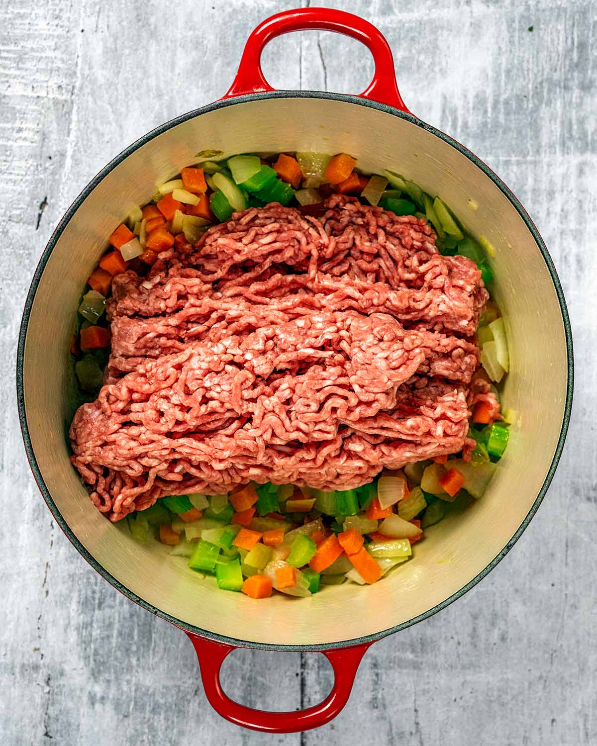 Lamb mince added to the pan.