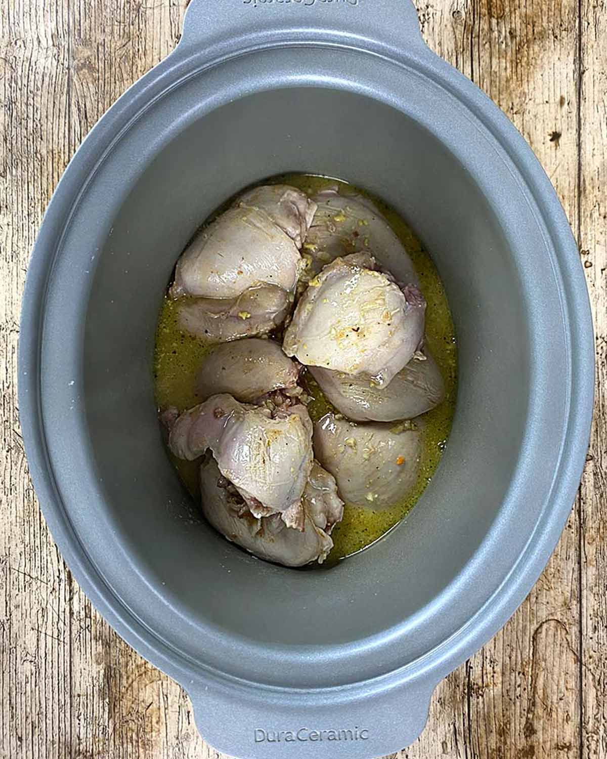 Honey mustard sauce added to the chicken in the slow cooker.