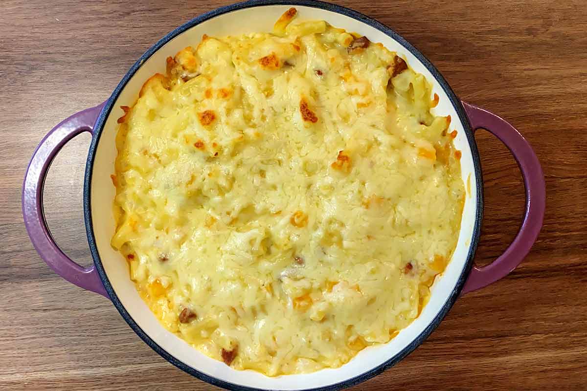 Mac and cheese just removed from the oven with a browned cheese top.