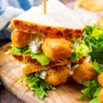 The best fish finger sandwich with a wooden skewer through it.