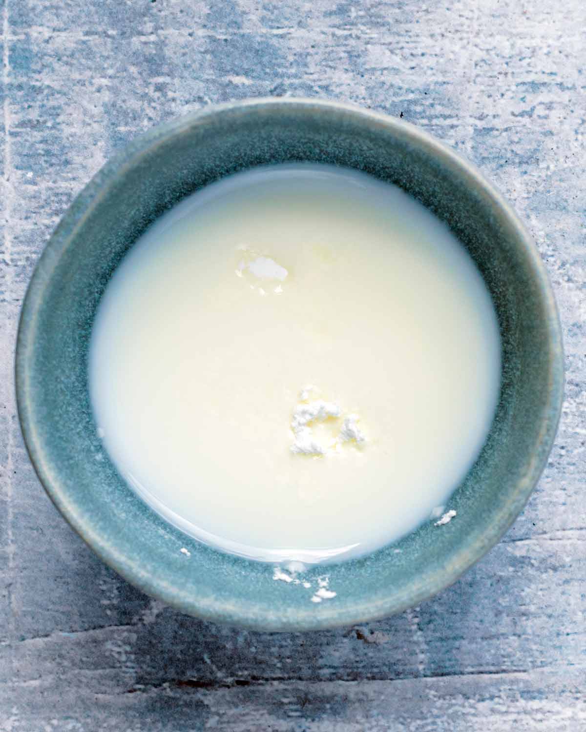 A small bowl of cornflour and milk mixed together.