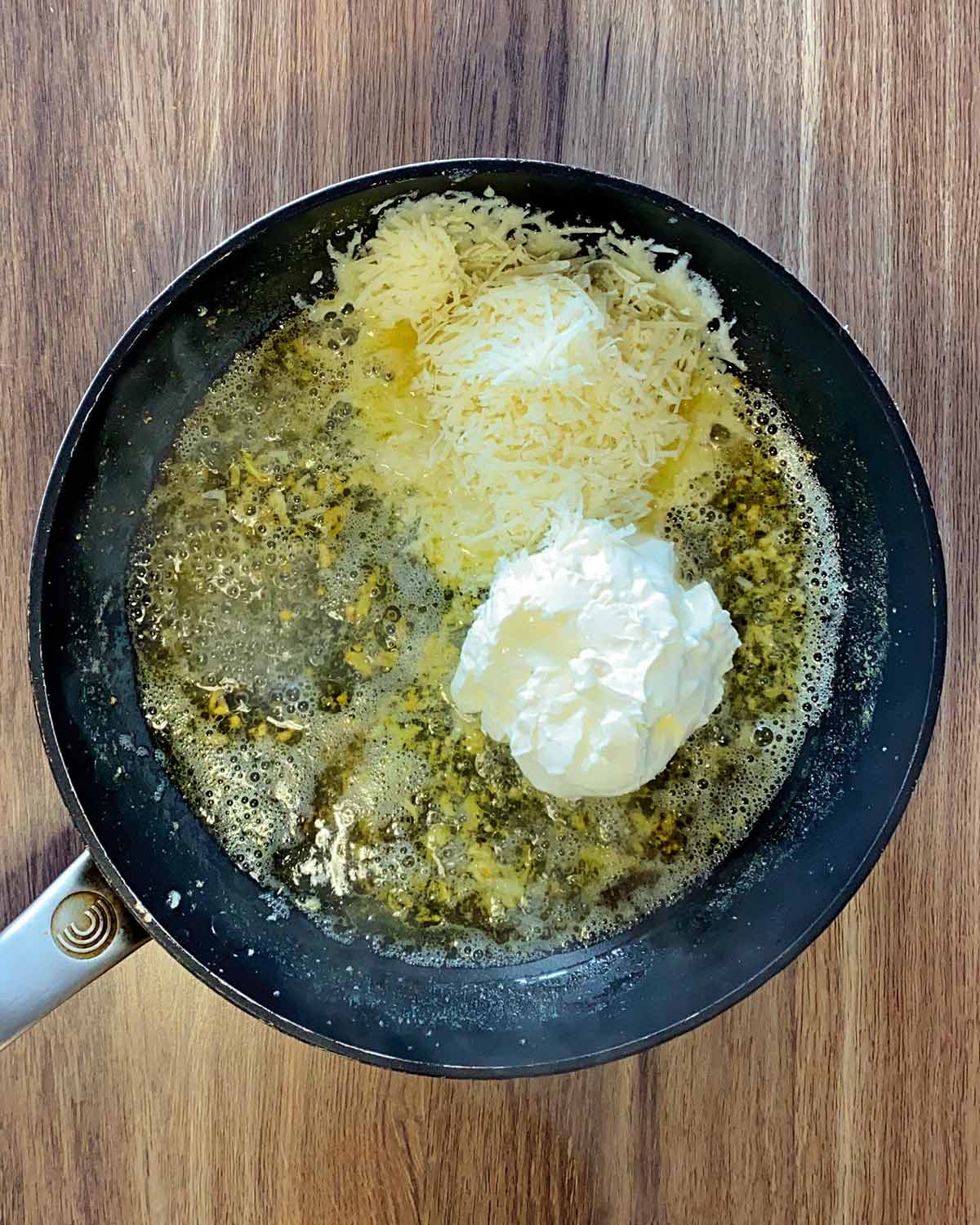 Cream cheese added to the pan.